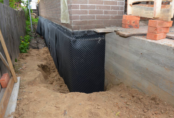 Happy homeowners after waterproofing job in Seaside Park